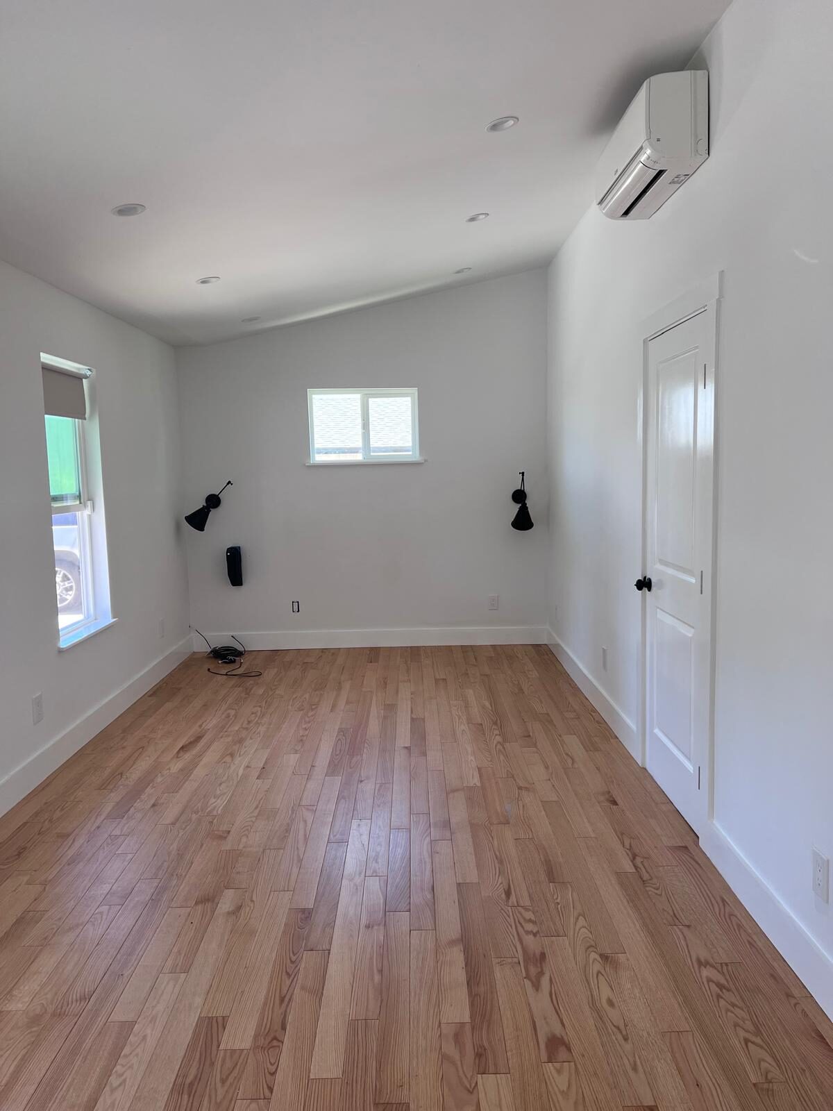 Home A — spacious bedroom with mini-split heating and cooling