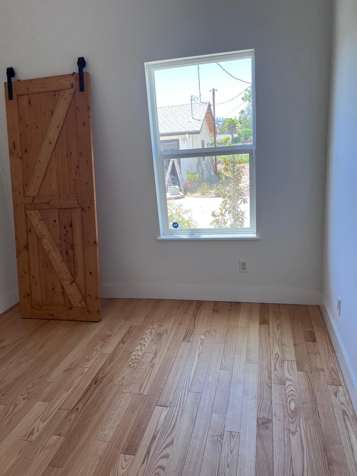 Home A — bedroom with sliding barn door