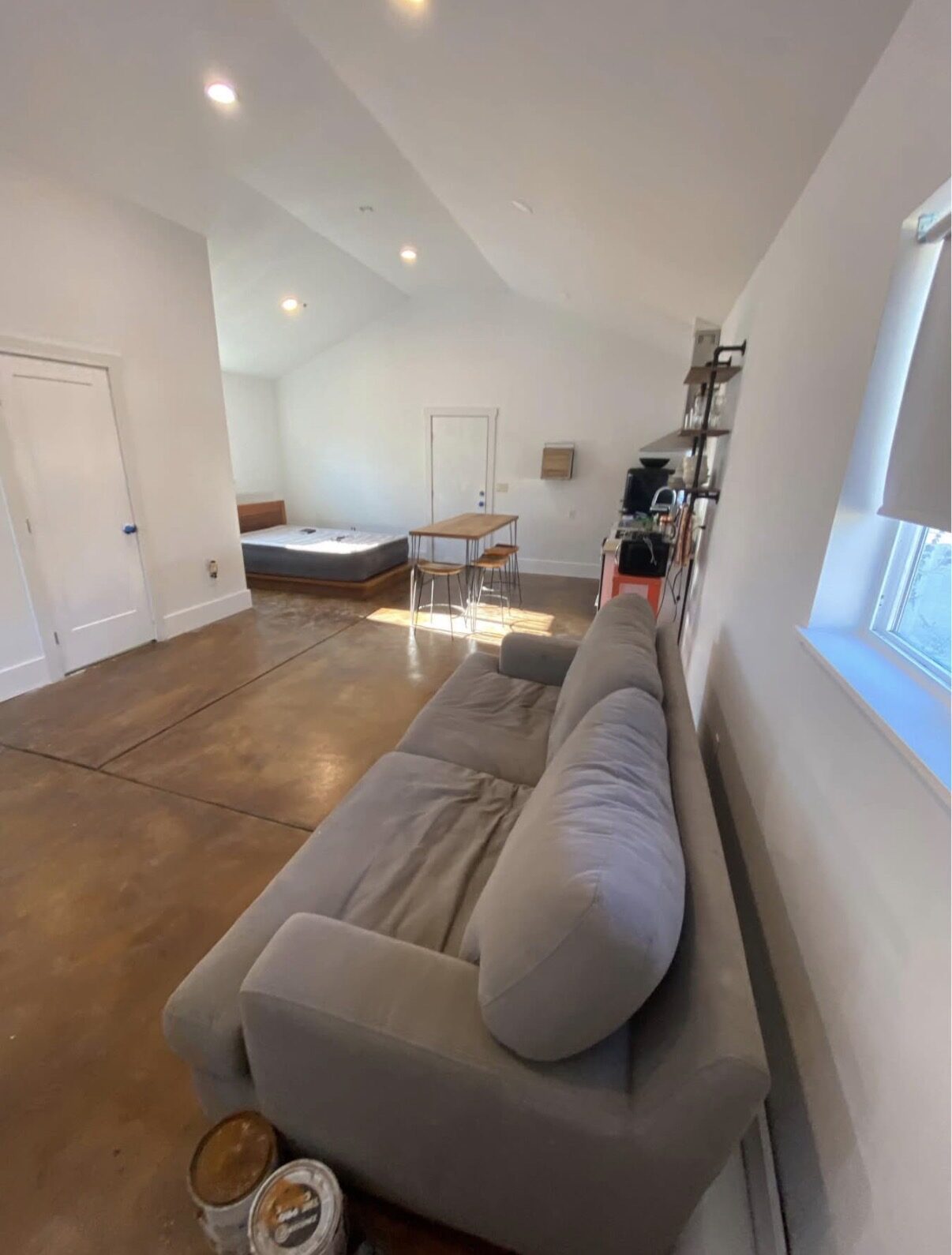 Studio B — living and sleeping area with dining nook